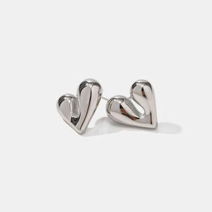 a pair of heart shaped earrings on a white background