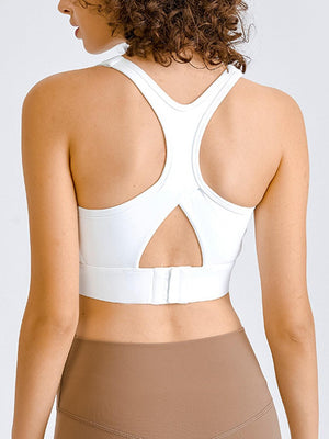 a woman wearing a white sports bra top