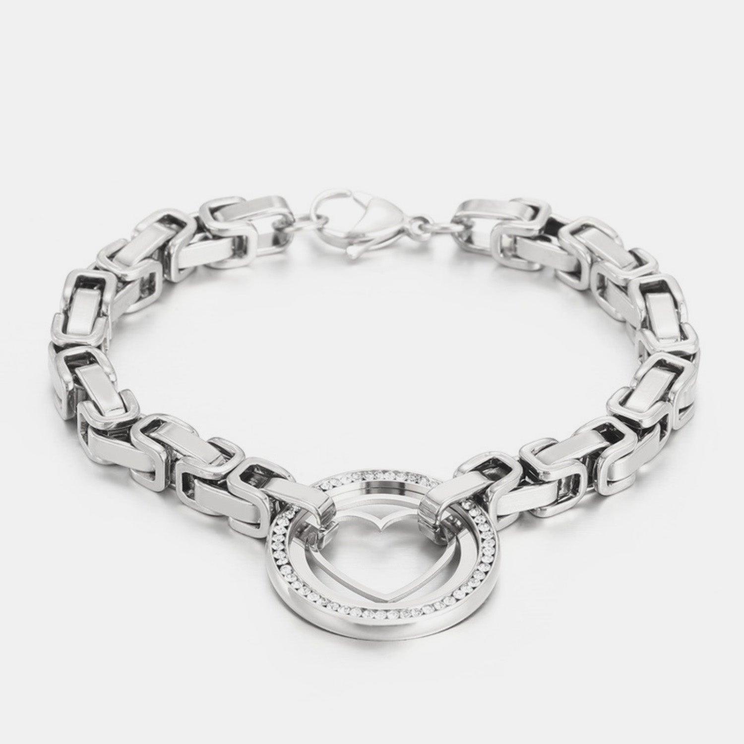 a silver bracelet with a circle clasp