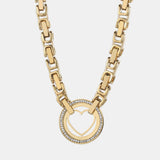 a gold necklace with a heart on it