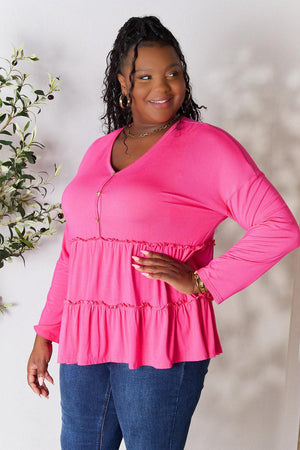 a woman in a pink top is posing for a picture