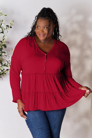 a woman in a red top is posing for a picture