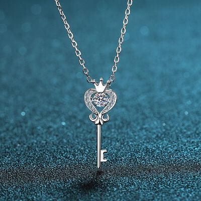 a key necklace with a heart and a crown on it