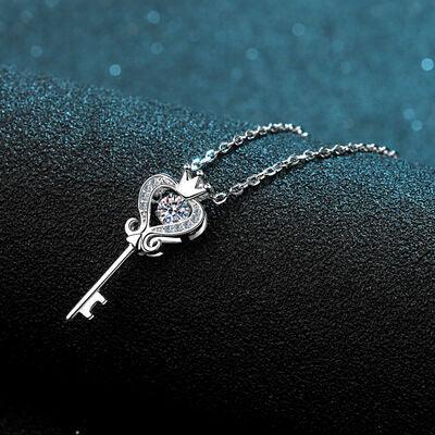 a key necklace with a heart and a key on it