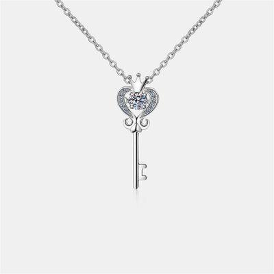 a necklace with a heart and a key on it
