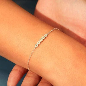 a woman's arm with a bracelet on it