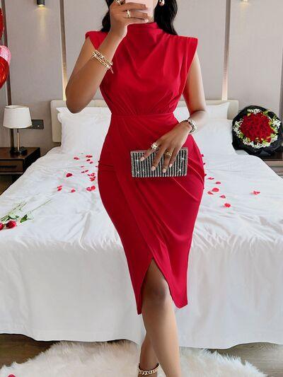 a woman in a red dress taking a selfie