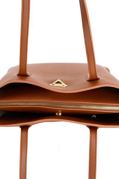 a brown handbag with a gold zipper