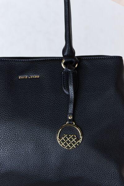 a black handbag with a gold logo on it