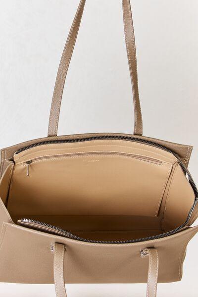 a beige handbag with a zippered closure
