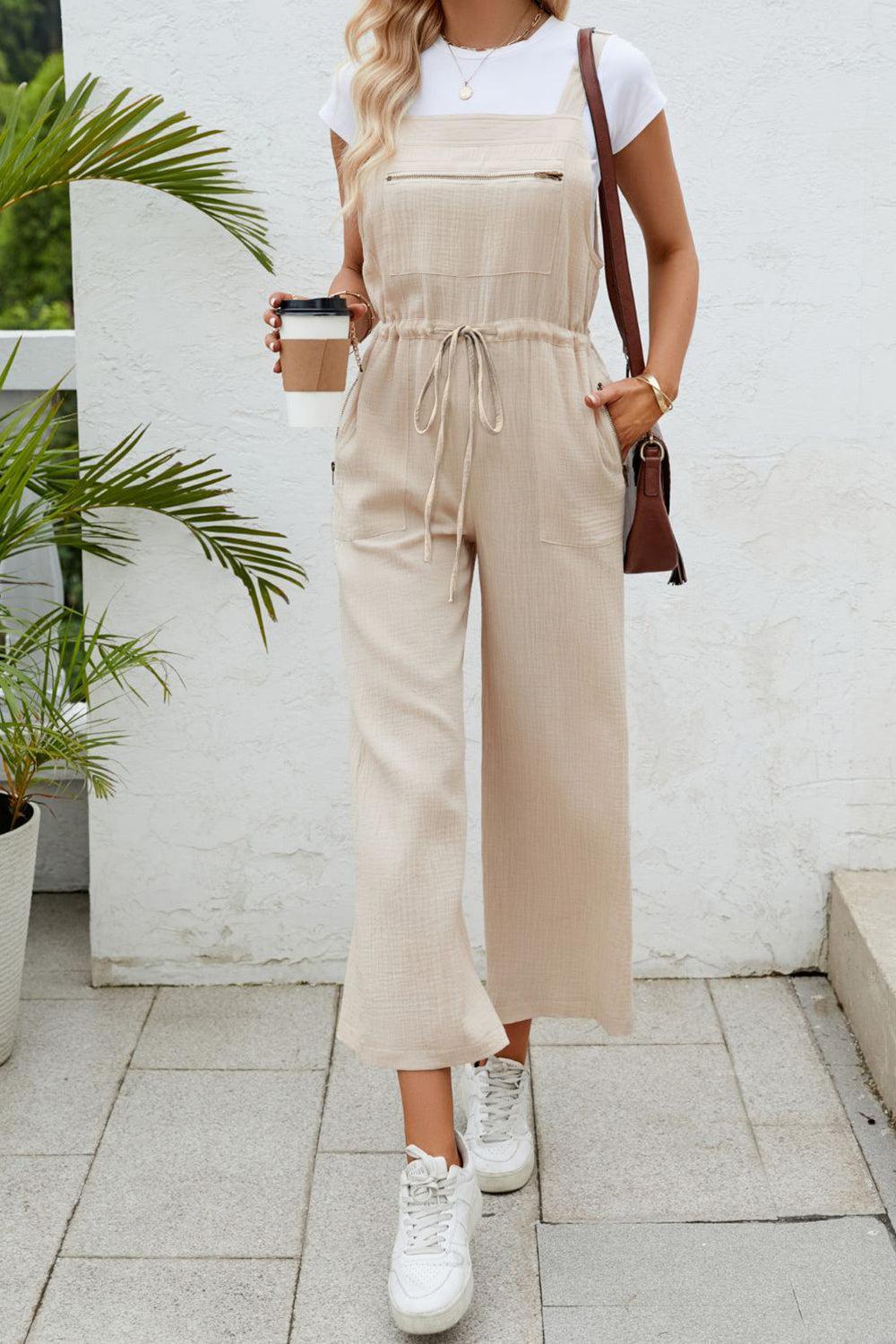 a woman standing on a sidewalk holding a cup of coffee