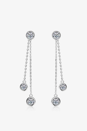 a pair of earrings with a dangling chain