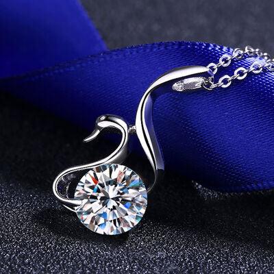 a diamond pendant on a blue ribbon