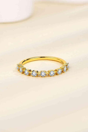 a yellow gold ring with five diamonds