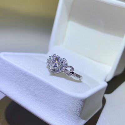 a diamond ring in a white box on a table