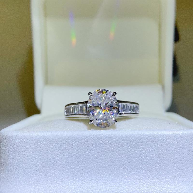 a diamond ring sitting on top of a white box