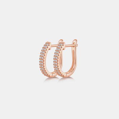 a pair of rose gold hoop earrings with diamonds