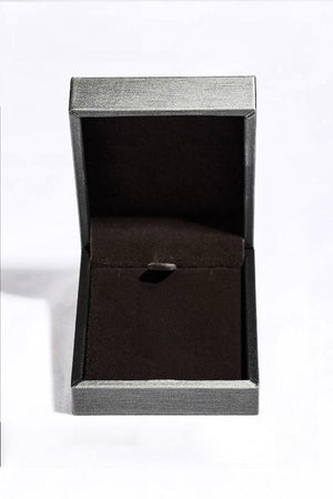 an open box with a ring inside of it