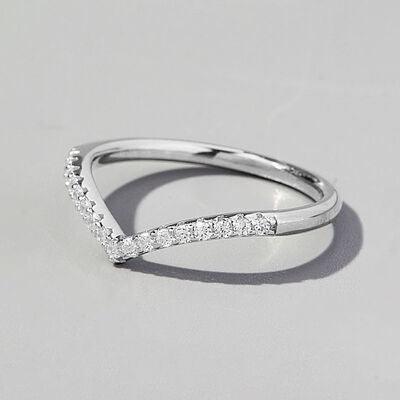 a close up of a diamond ring on a white background