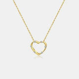 a gold necklace with a heart shaped pendant