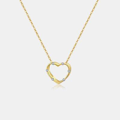 a gold necklace with a heart shaped pendant