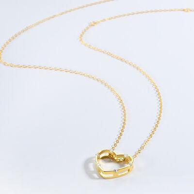 a gold necklace on a white background