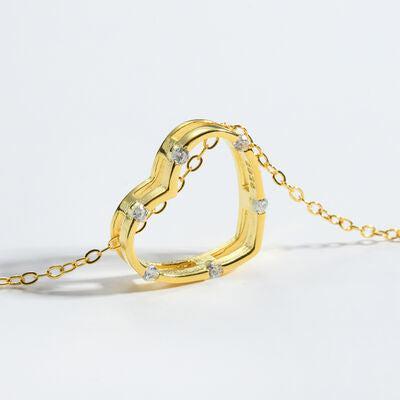 a gold ring with a chain attached to it