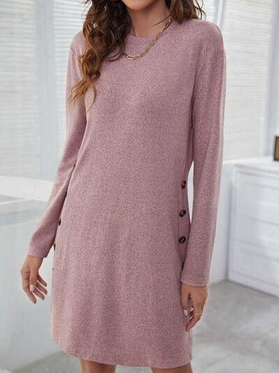 a woman wearing a pink sweater dress