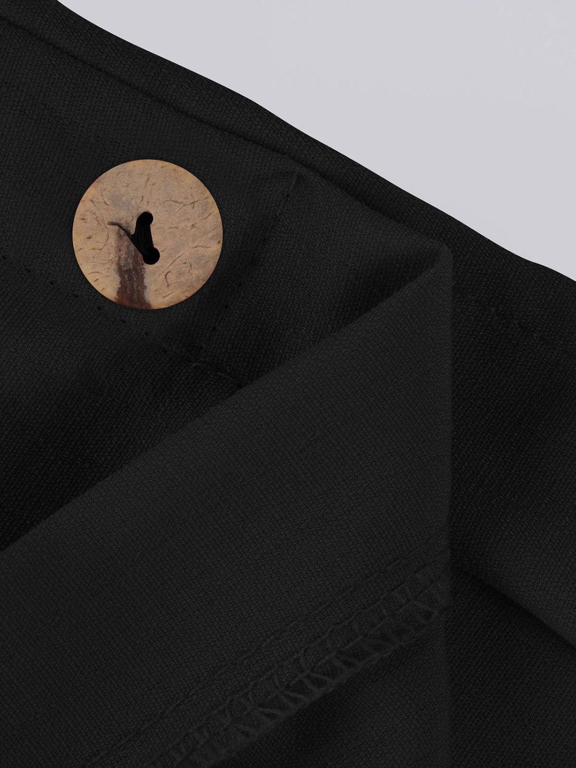 a close up of a button on a black shirt