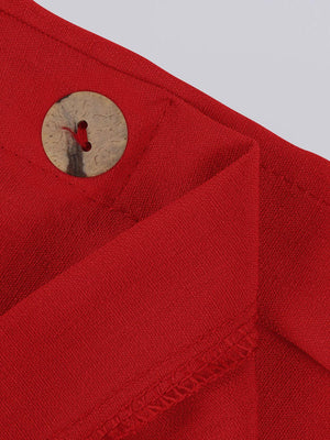 a button on a red shirt with a white background