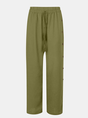 a green pants with buttons on the side