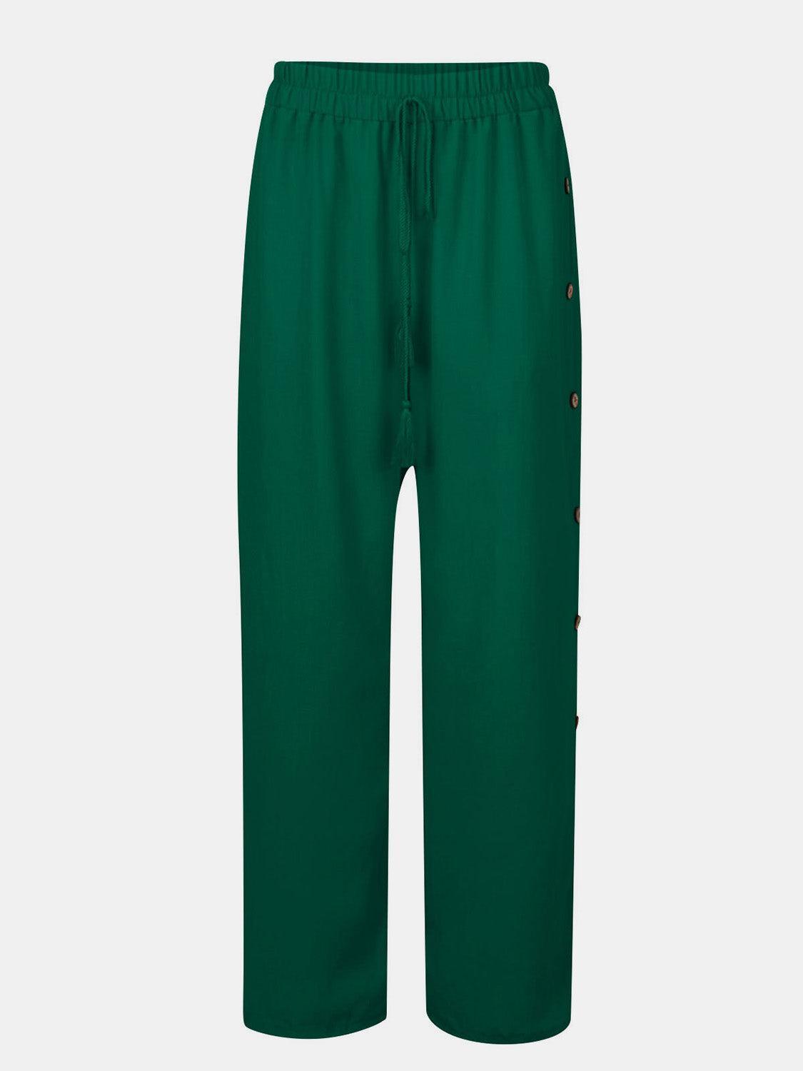 a green pants with buttons on the side