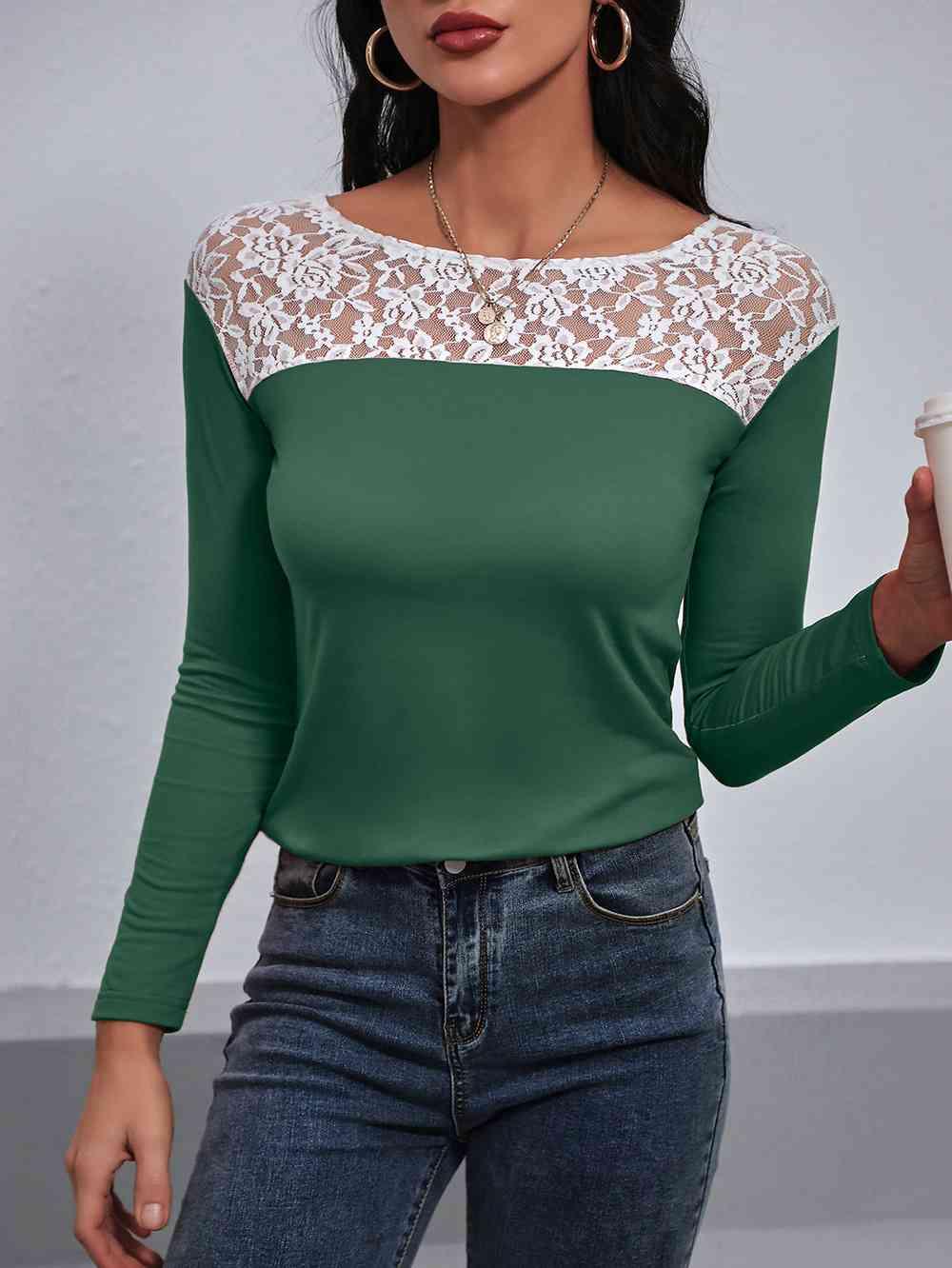 a woman wearing a green and white top