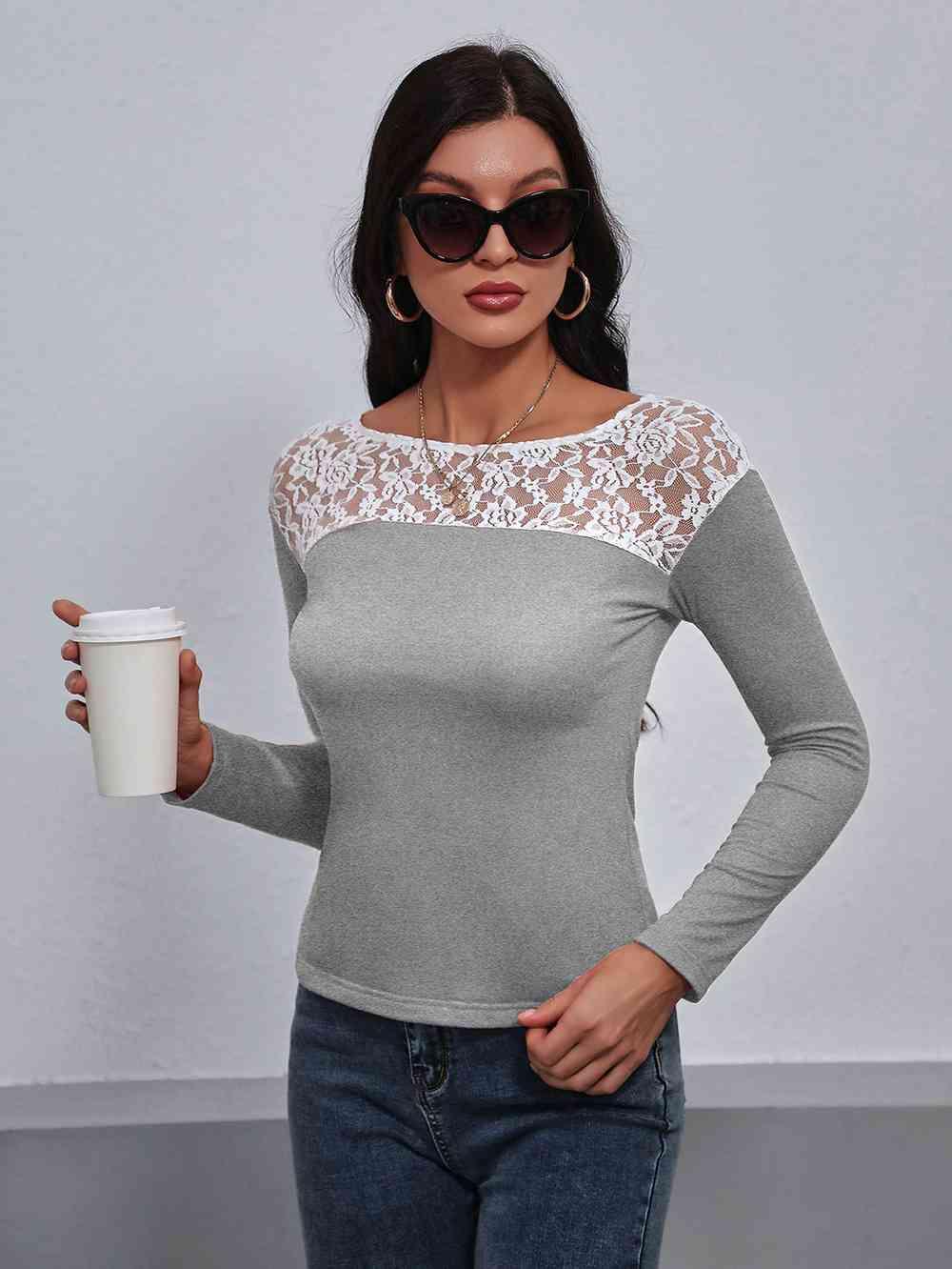 a woman holding a coffee cup and wearing sunglasses