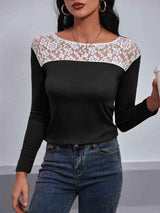 a woman wearing a black and white top