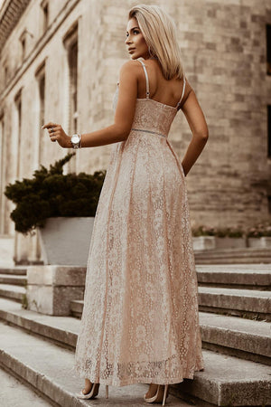 a woman in a dress standing on some steps