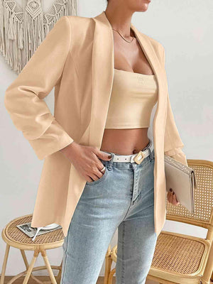 a woman standing in a chair wearing a tan jacket
