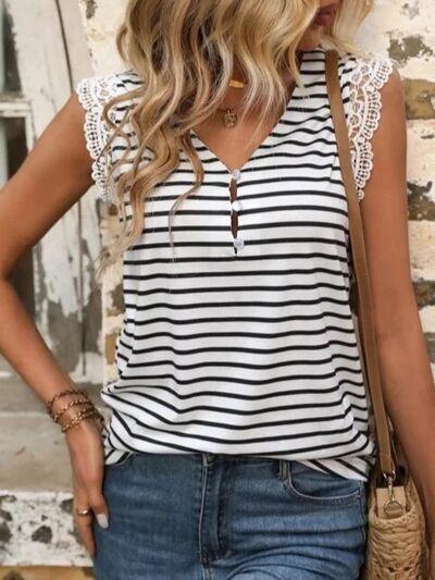 a woman wearing a white and black striped top