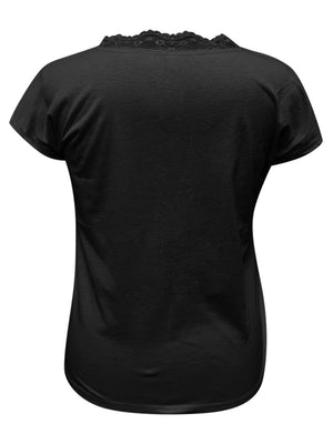 a woman wearing a black shirt with a lace back