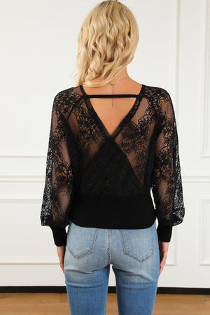 the back of a woman wearing a black top