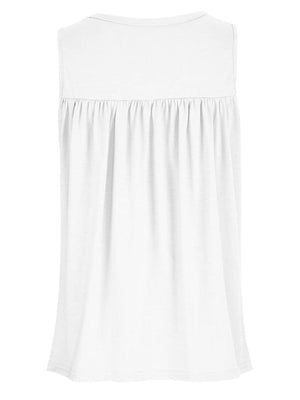 a white top with a ruffled neckline