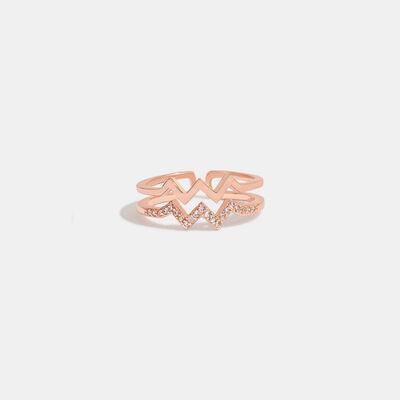 a rose gold ring with diamonds on it