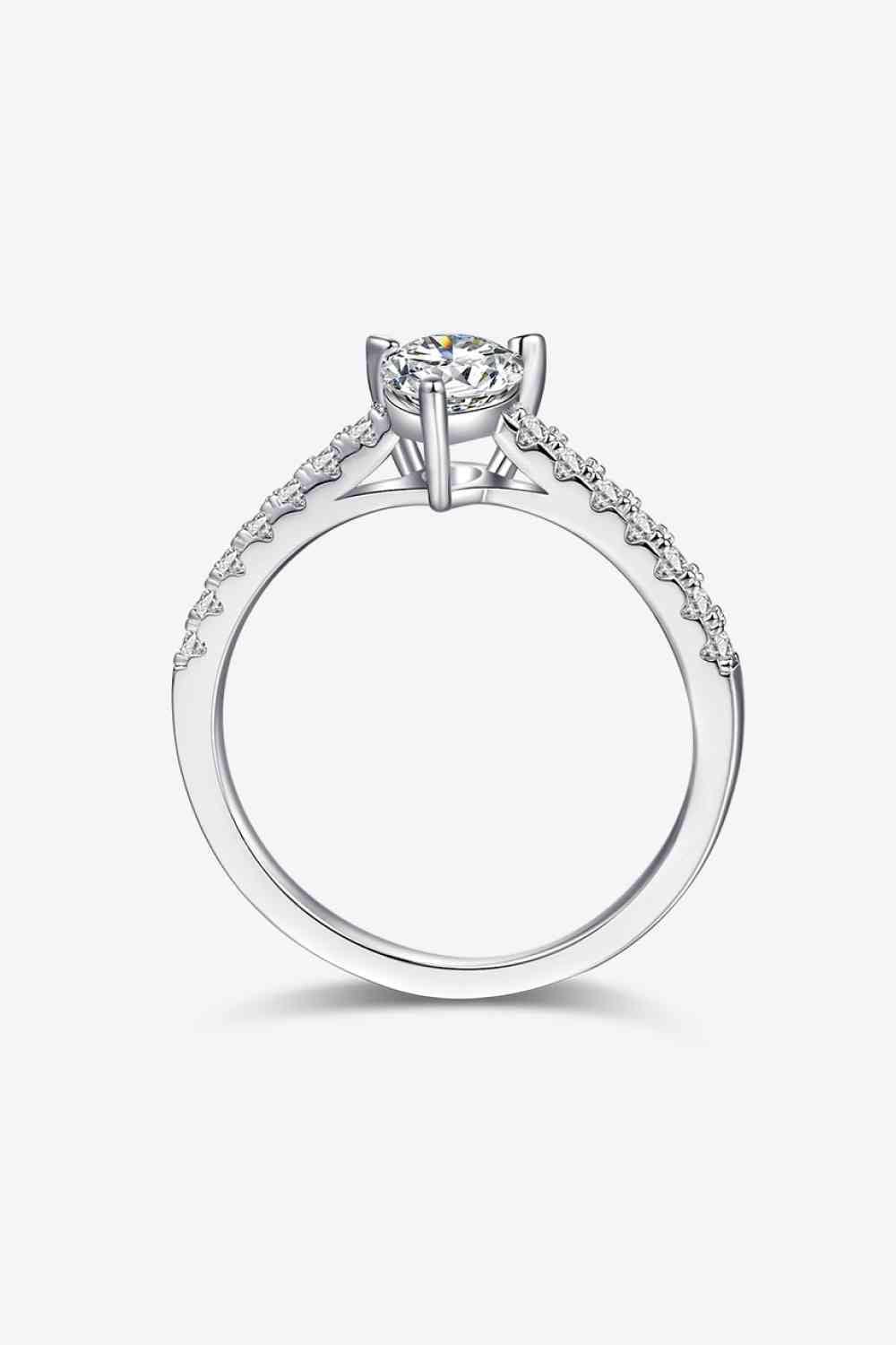 a white gold engagement ring with diamonds on the side