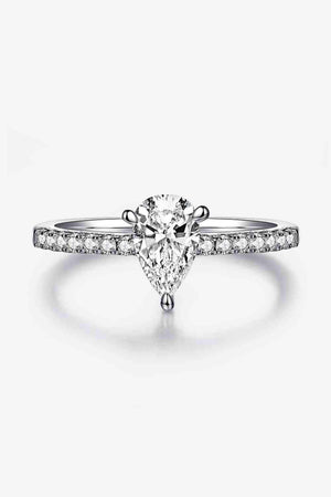 a white gold ring with a pear shaped diamond