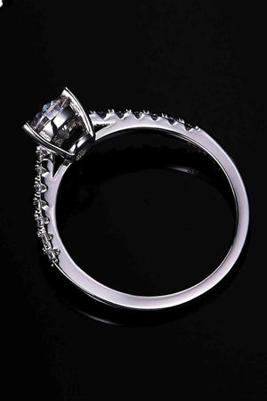 a close up of a diamond ring on a black background