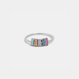 a white gold ring with multicolored stones