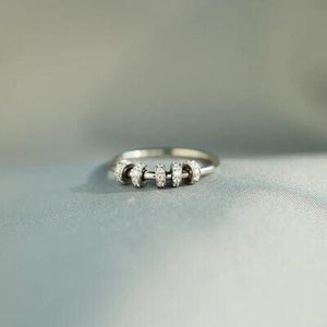 a close up of a ring on a white surface