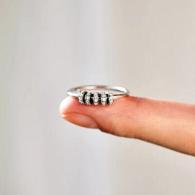 a woman's finger with a ring on it