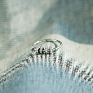 a close up of a ring on a fabric