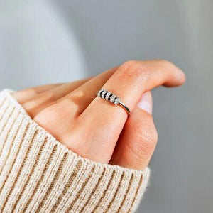 a woman's hand with a ring on it